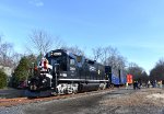 Entering the stop adjacent to Reed & Perrine Co. Store in Tennent with GP38-2 # 2005 on the point-note Santa waving